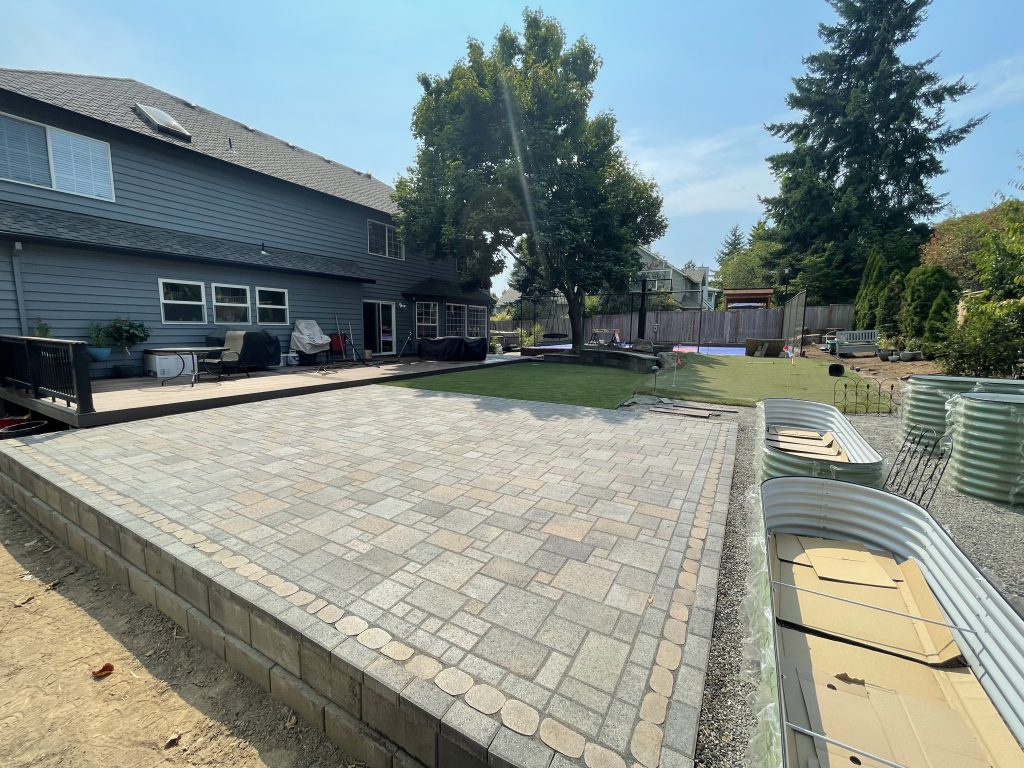 An alternate view of the broad backyard paver patio.