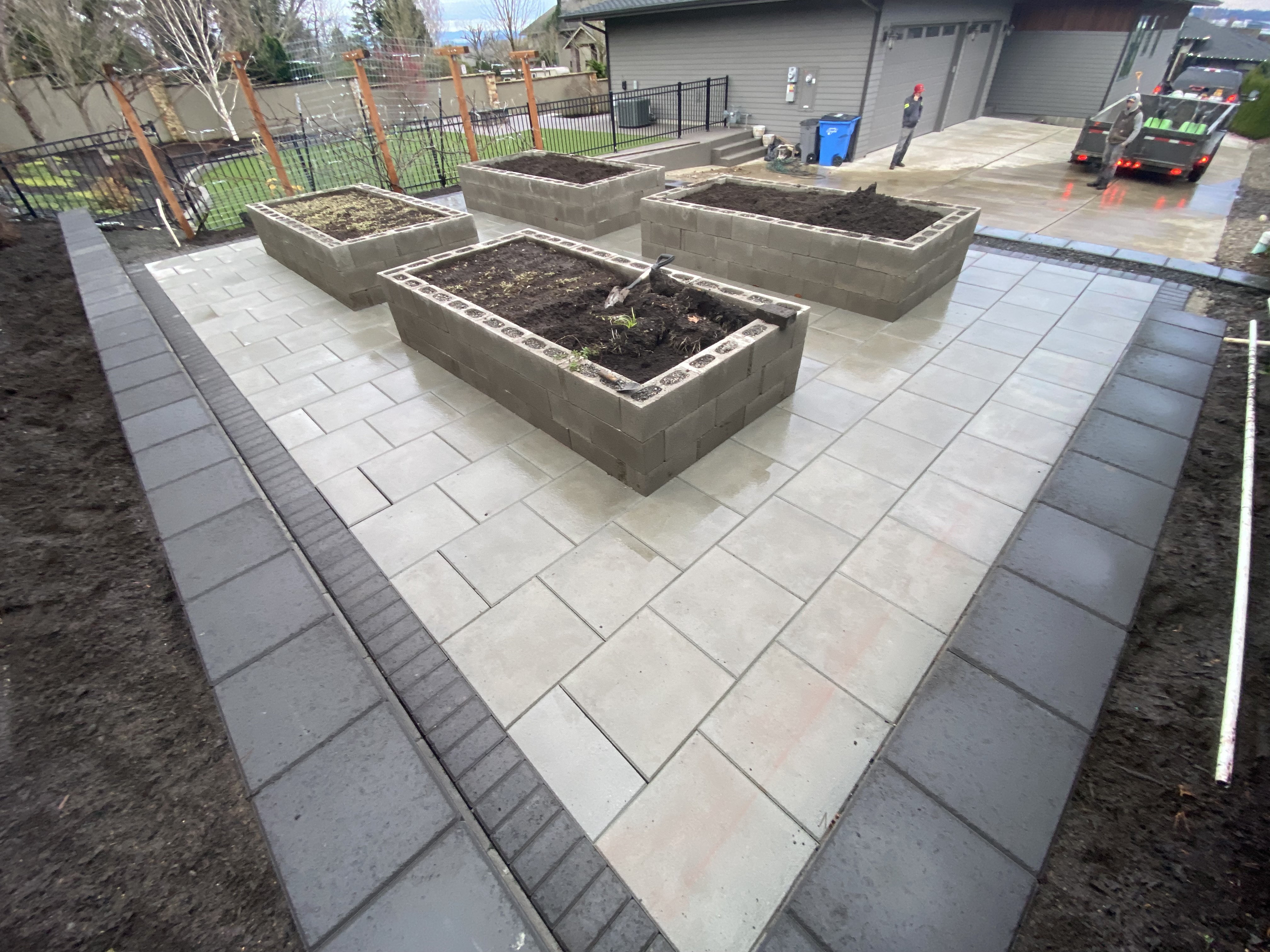 Raised garden beds integrated into a landscaped patio