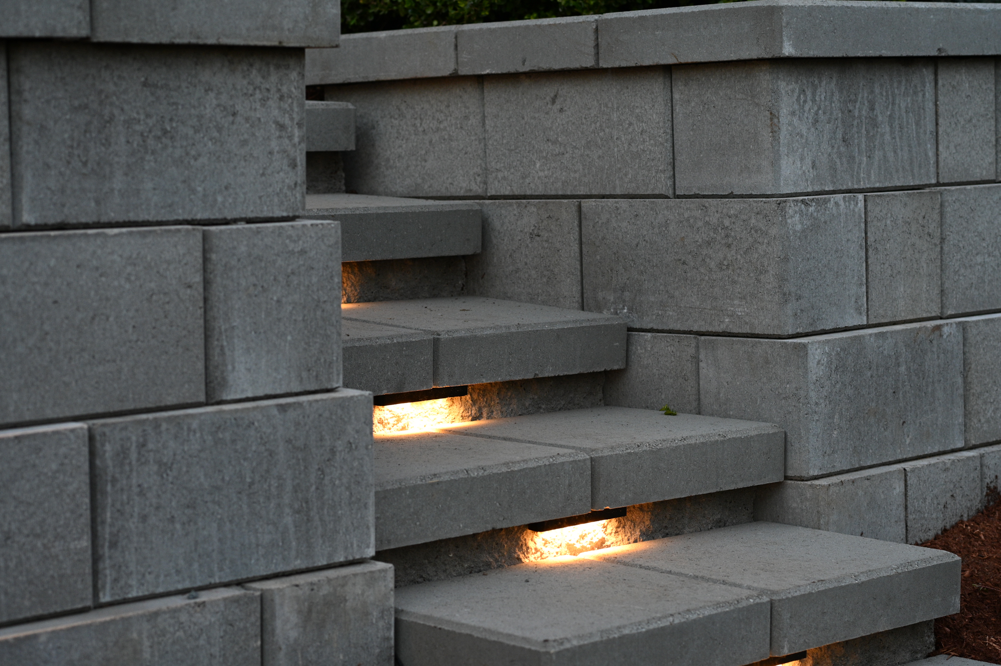 Integrated warm lighting illuminating masonry steps