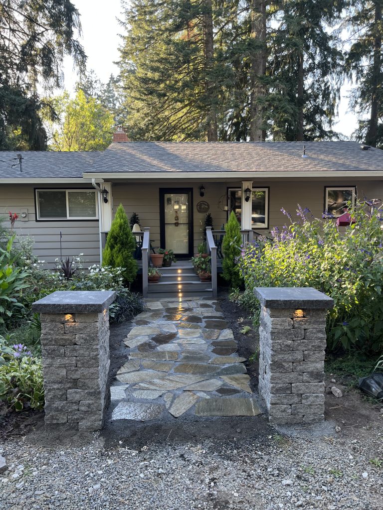 Front-entry stone steps and a welcoming garden path.